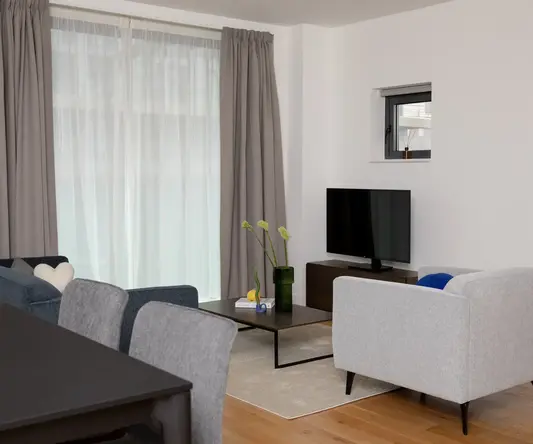 a living room with a tv and a table