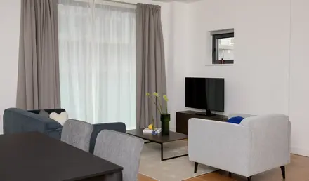 a living room with a tv and a table