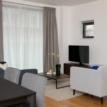 a living room with a tv and a table