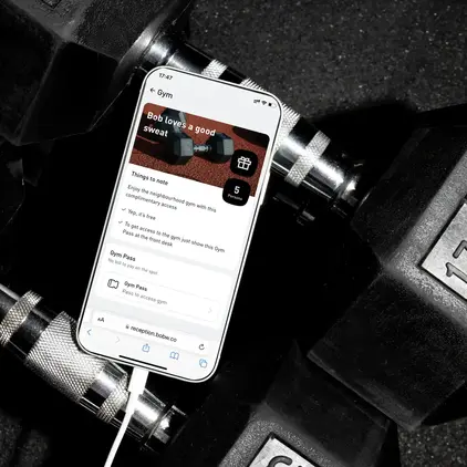 a cellphone on a black dumbbell