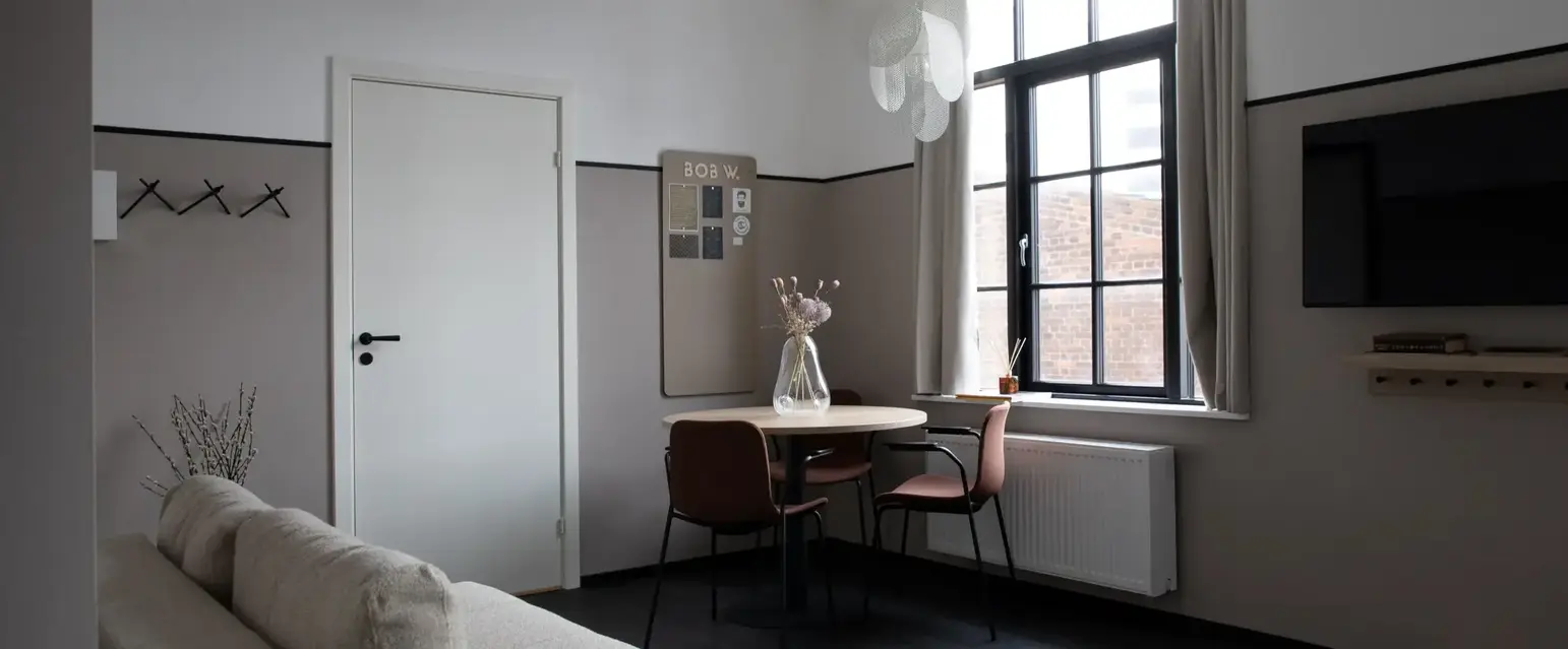 a room with a table and chairs