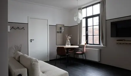 a room with a table and chairs