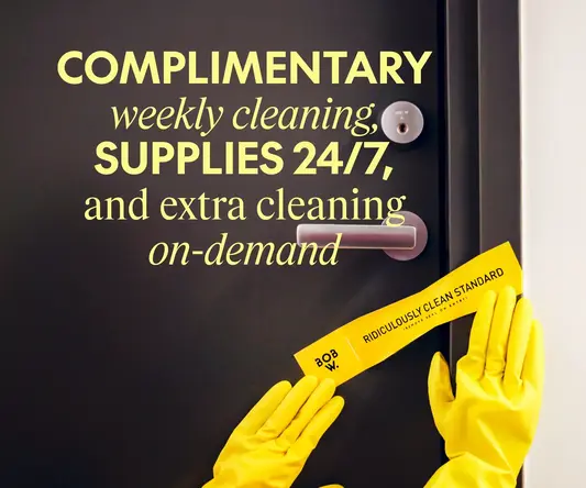 a pair of hands wearing yellow gloves