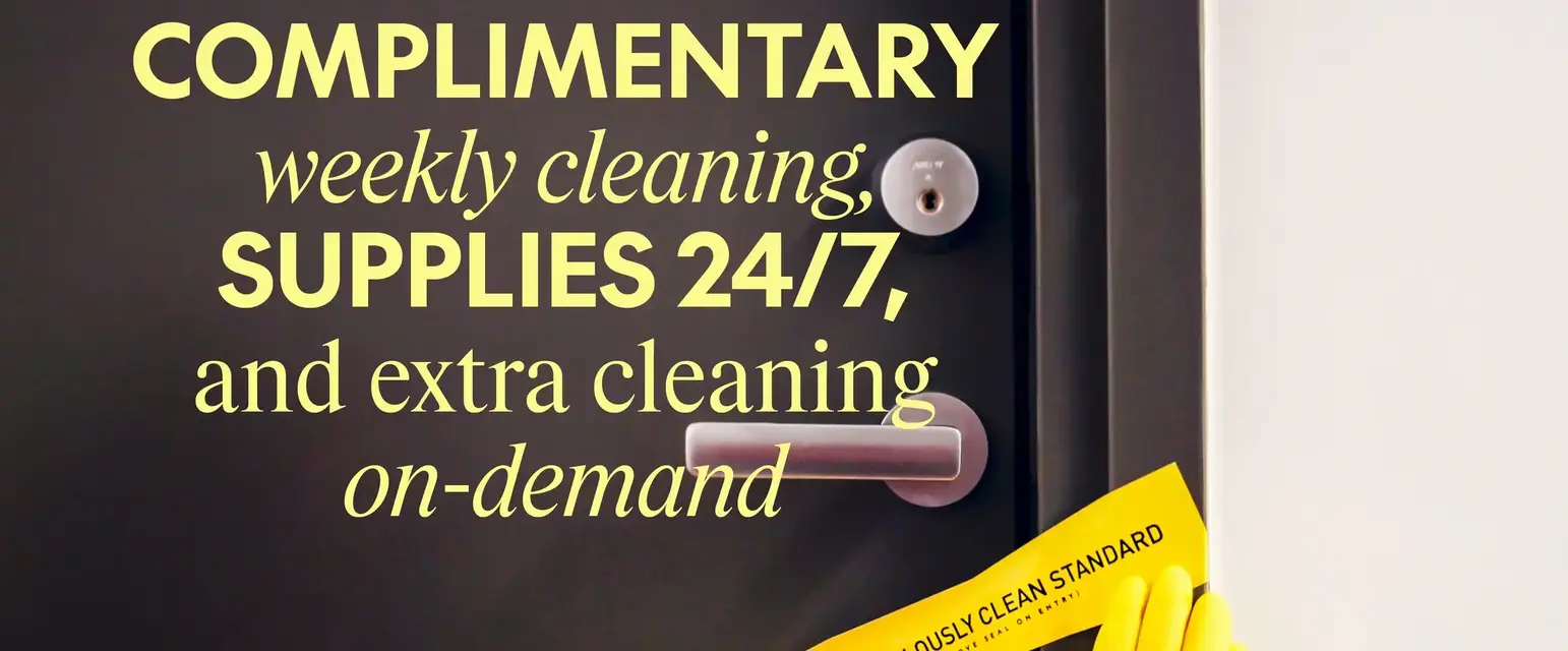 a pair of hands wearing yellow gloves