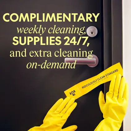 a pair of hands wearing yellow gloves