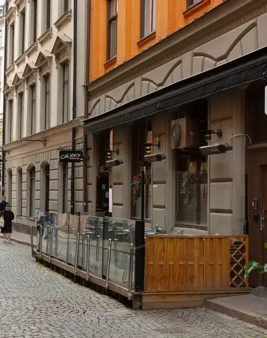 a street with a building and a sign