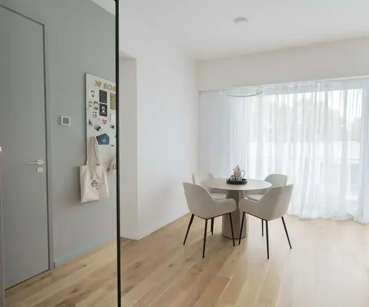 a room with a table and chairs