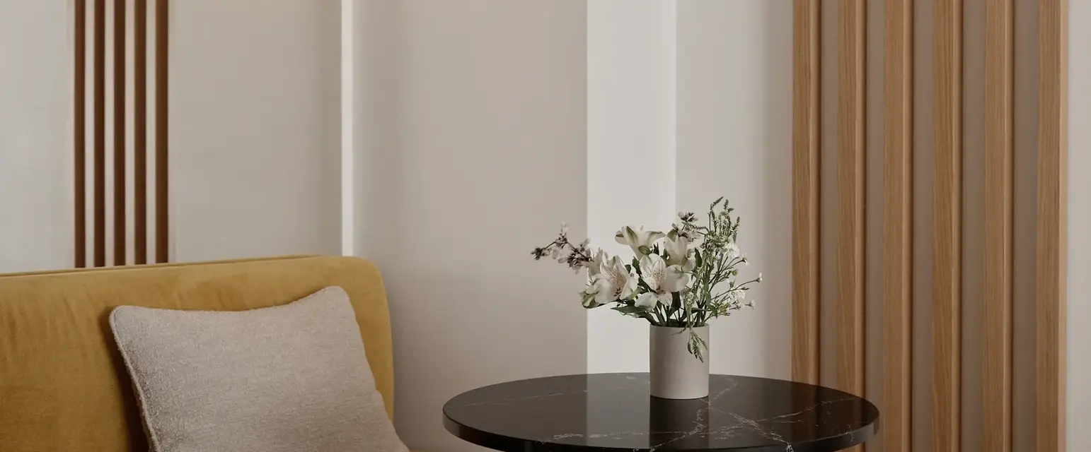 a table with a vase of flowers on it