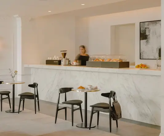 a counter with a person behind it