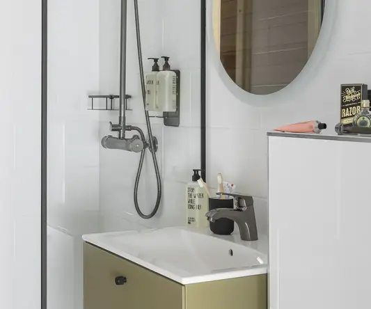 a bathroom with a shower and sink