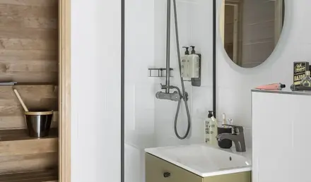 a bathroom with a shower and sink