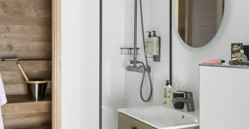 a bathroom with a shower and sink