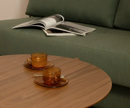 a coffee table with two cups on it