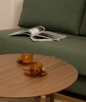 a coffee table with two cups on it
