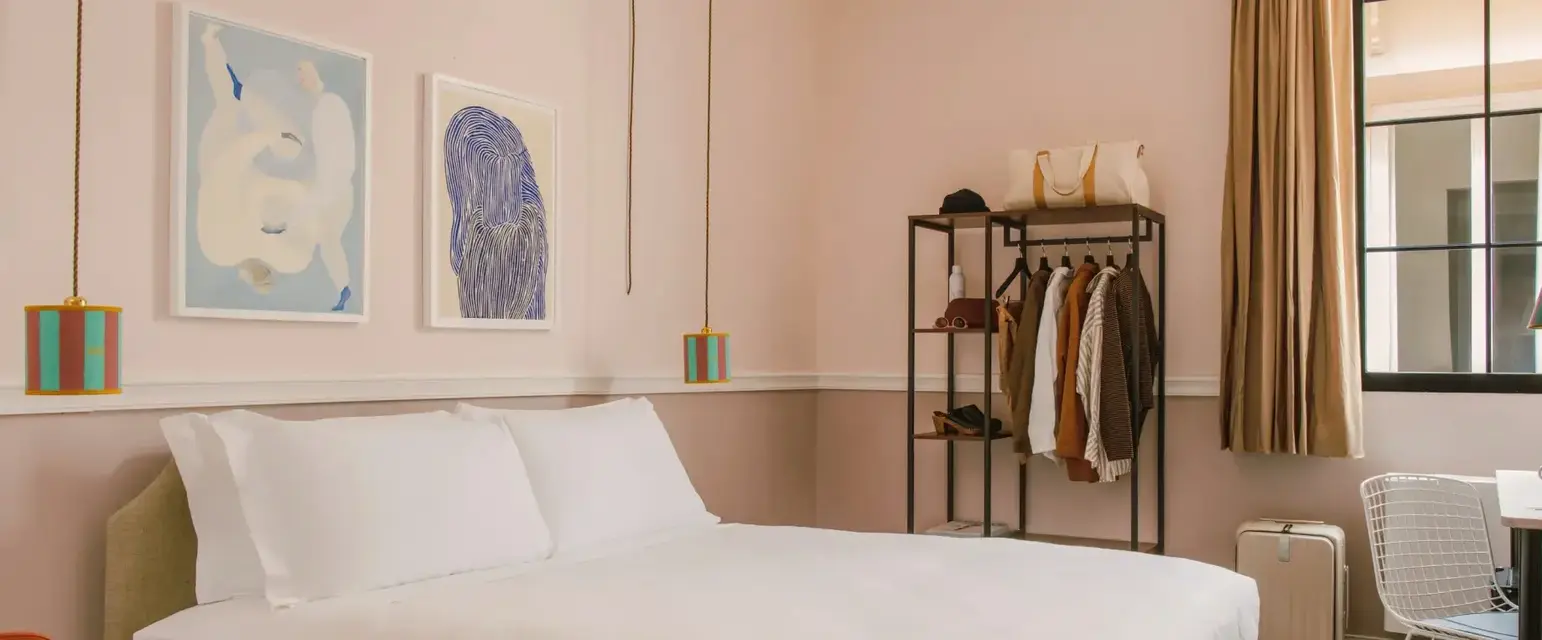 a bedroom with a bed and a shelf