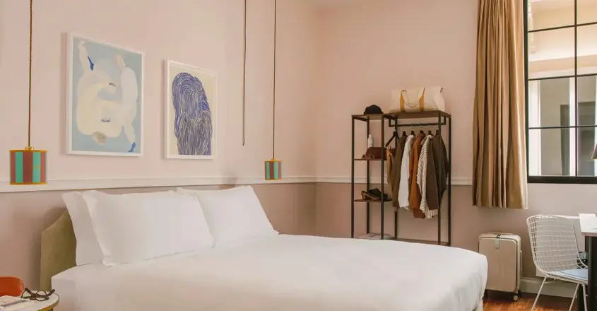 a bedroom with a bed and a shelf