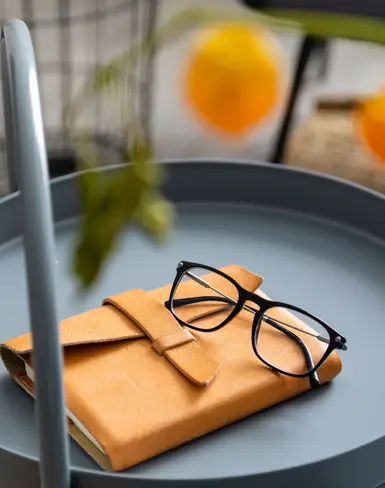 a pair of glasses on a book