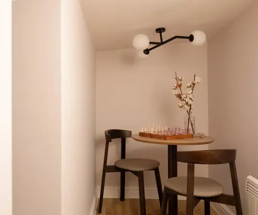 a table with chairs and chess board