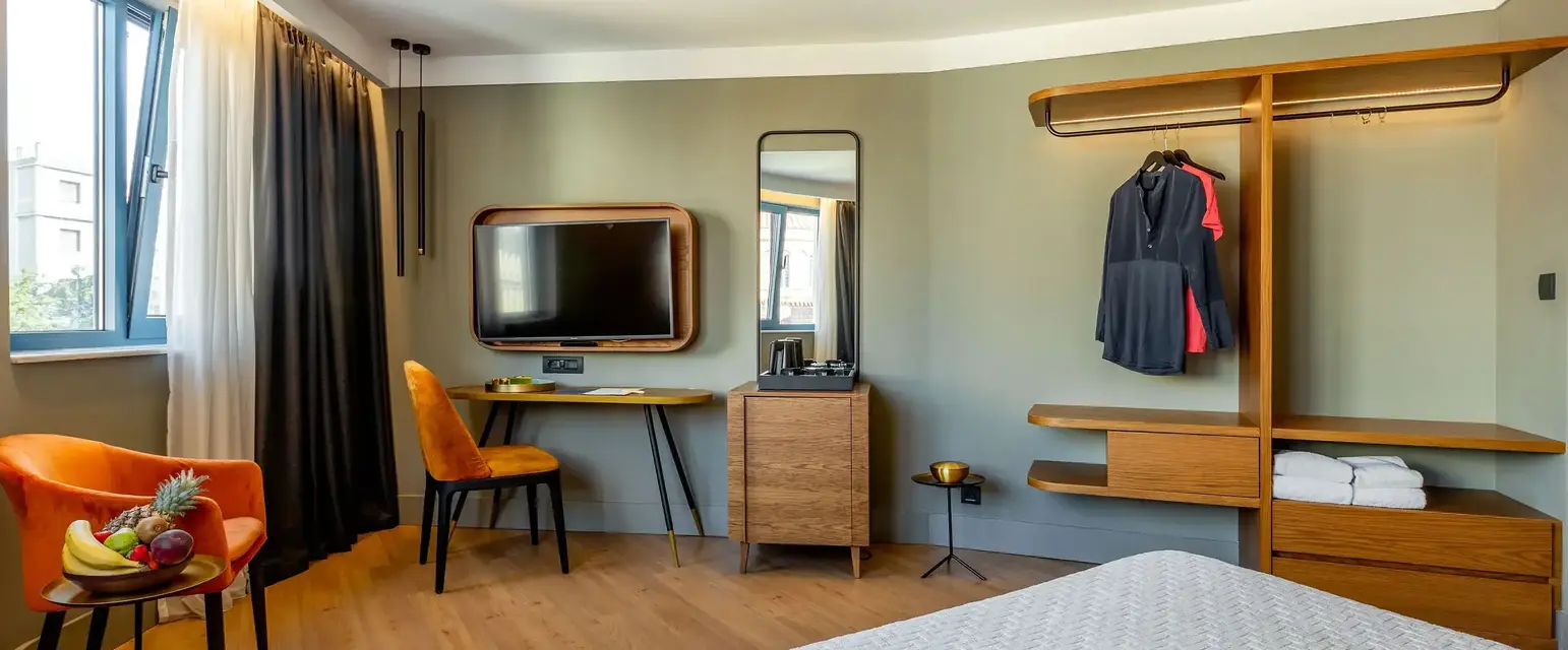 a room with a bed and a tv