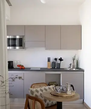 a kitchen with a table and chairs