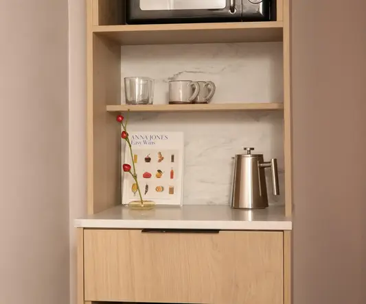 a microwave on a shelf