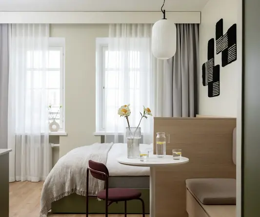 a room with a bed and a table