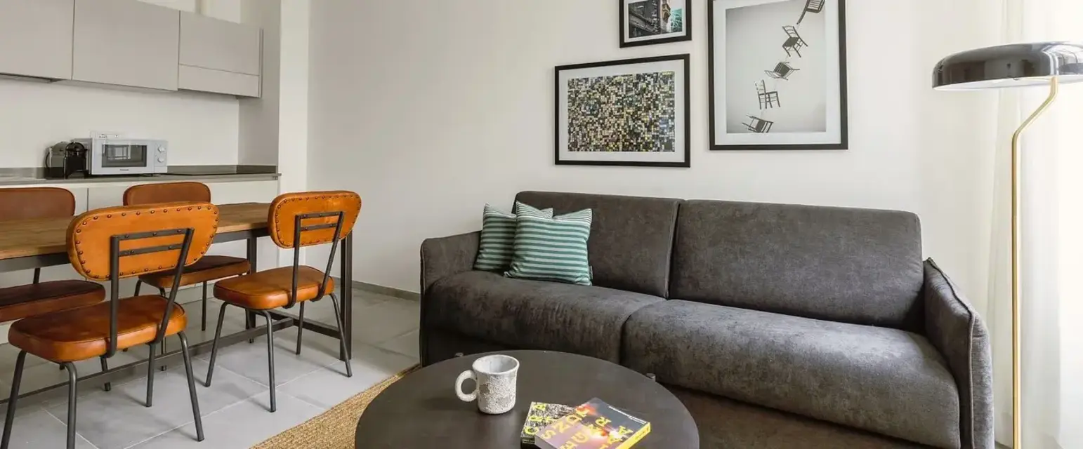 a living room with a couch and a table
