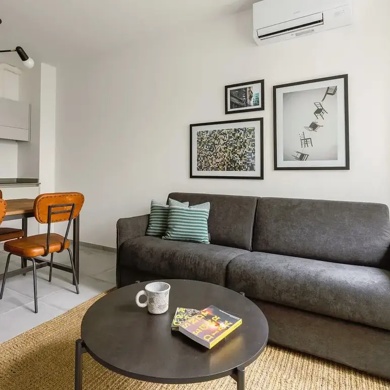 a living room with a couch and a table