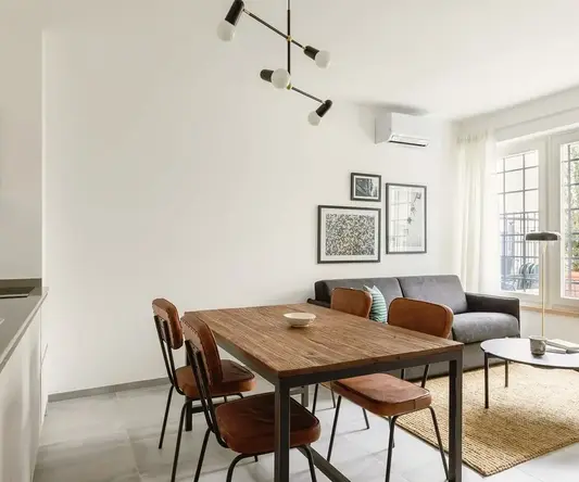 a dining table and chairs in a room
