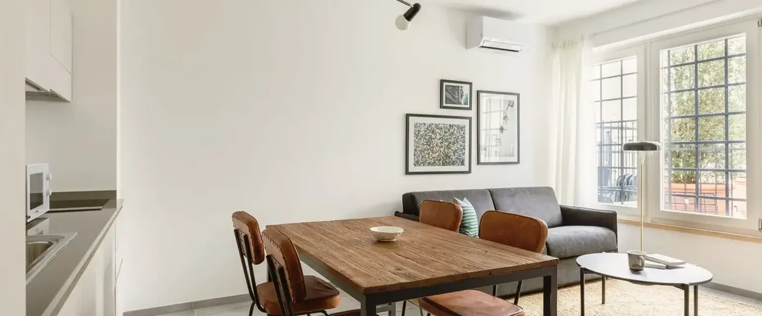 a dining table and chairs in a room