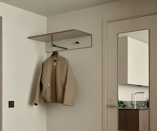 a coat on a swinger in a room