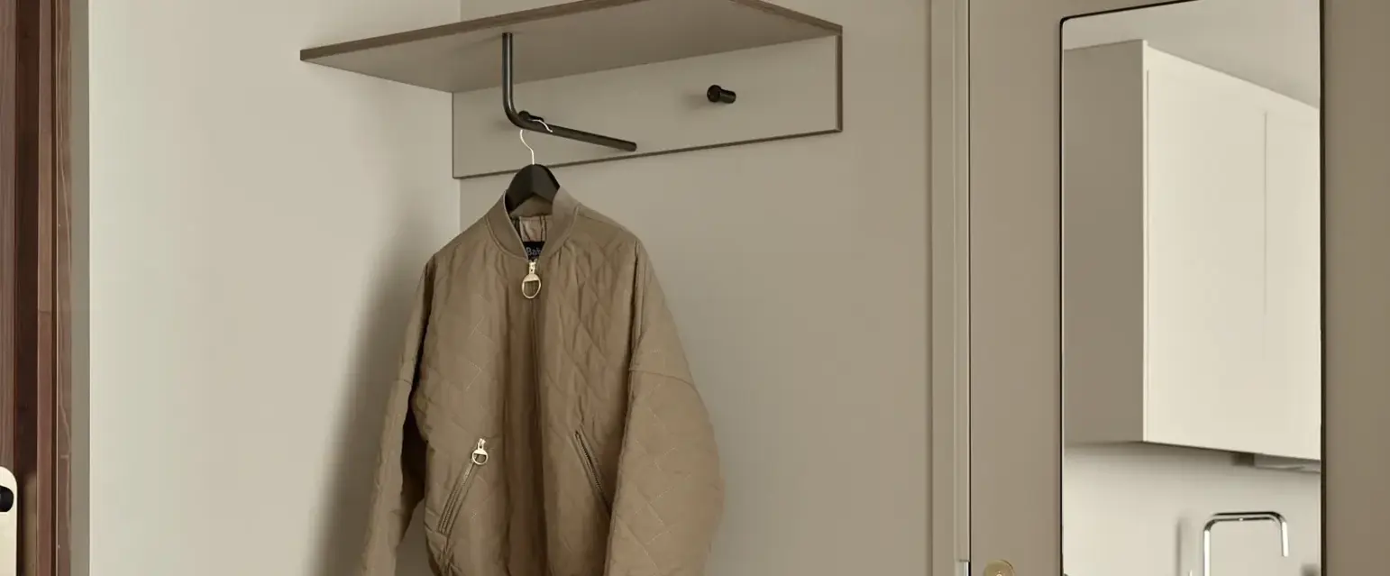 a coat on a swinger in a room