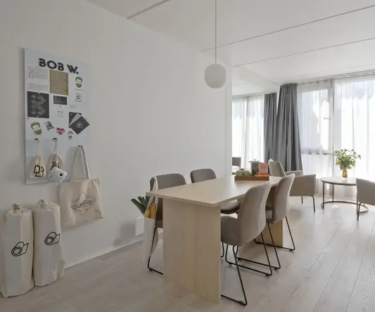 a room with a table and chairs