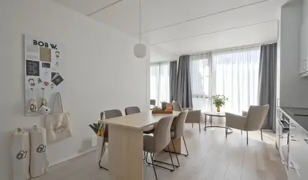 a room with a table and chairs