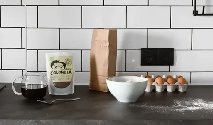 a kitchen counter with a bag of flour and eggs
