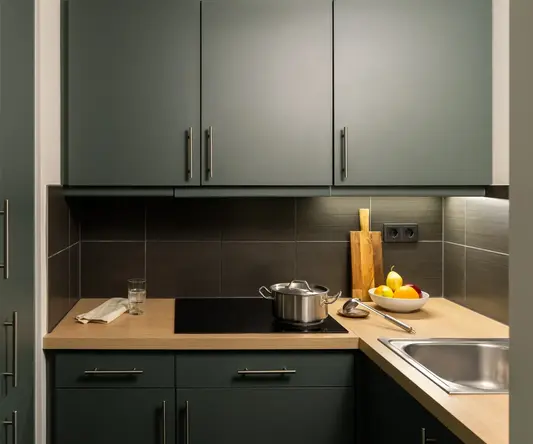 a kitchen with grey cabinets and a stove