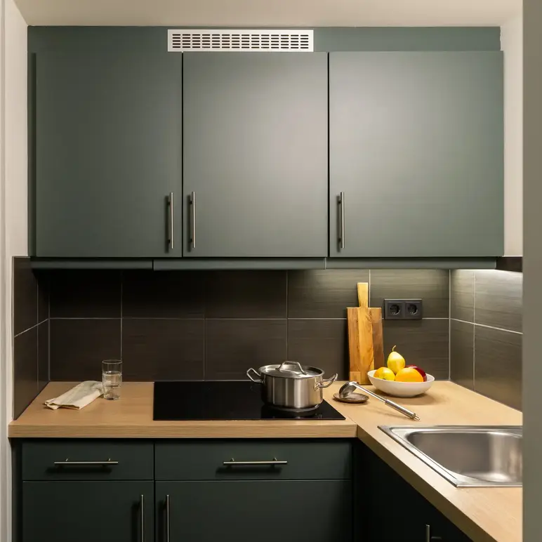 a kitchen with grey cabinets and a stove