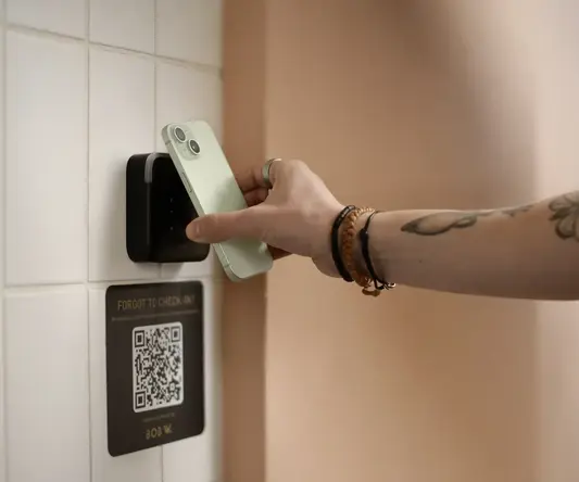 a person using a cell phone to insert a card