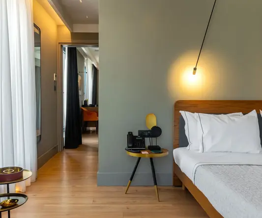 a bedroom with a bed and a table