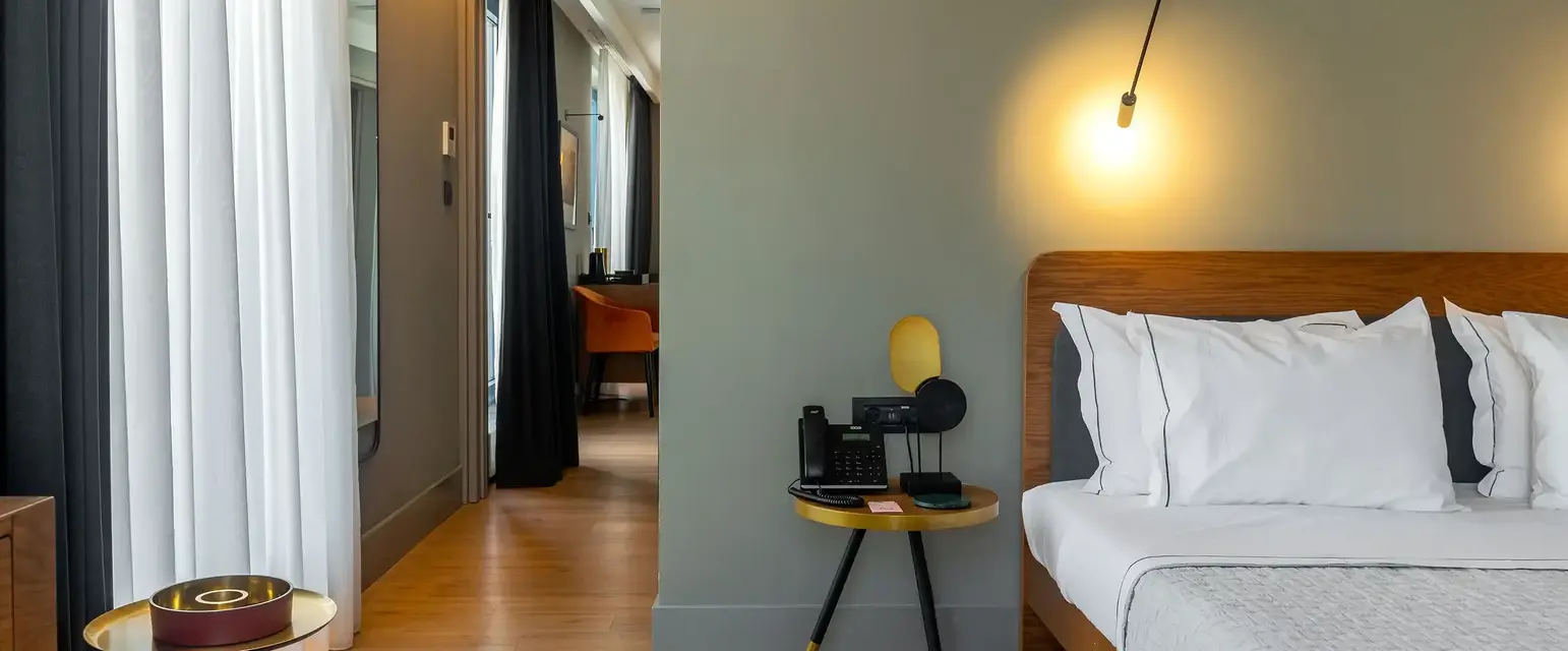 a bedroom with a bed and a table