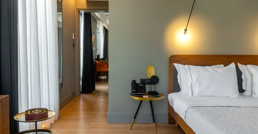 a bedroom with a bed and a table