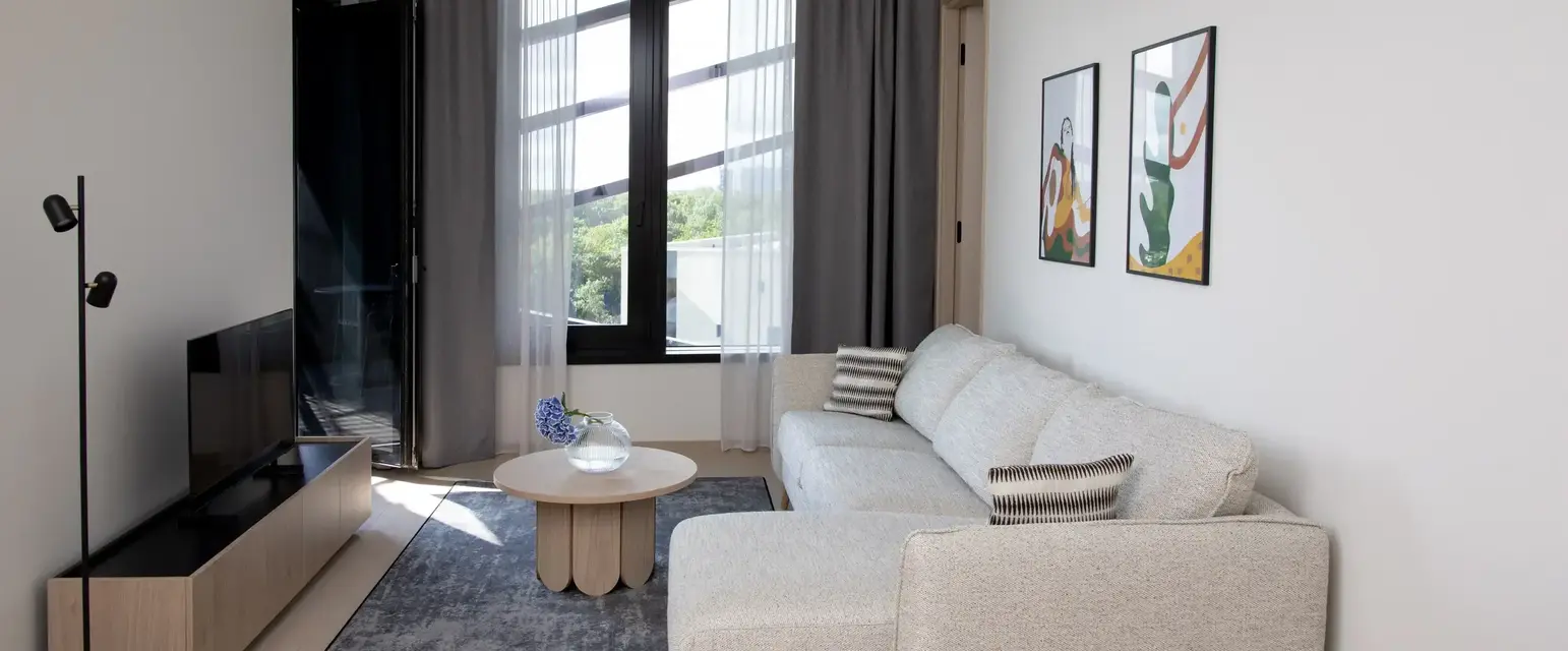 a living room with a couch and a table