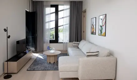 a living room with a couch and a table