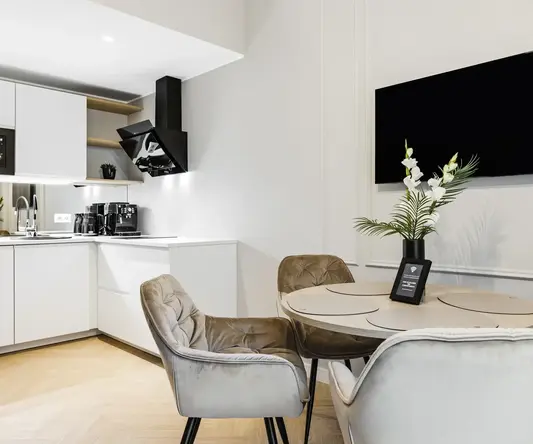 a room with a table and chairs