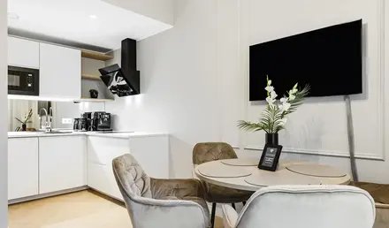 a room with a table and chairs