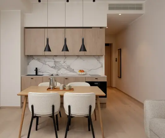 a dining table and chairs in a room