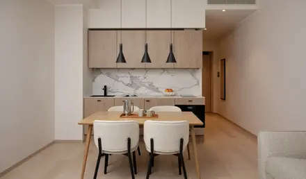 a dining table and chairs in a room