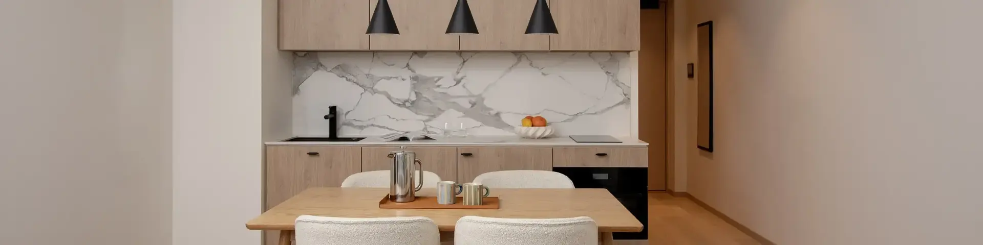 a dining table and chairs in a room