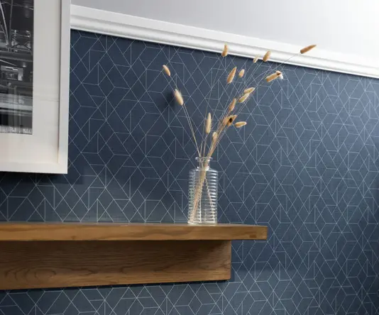 a shelf with a vase of flowers on it