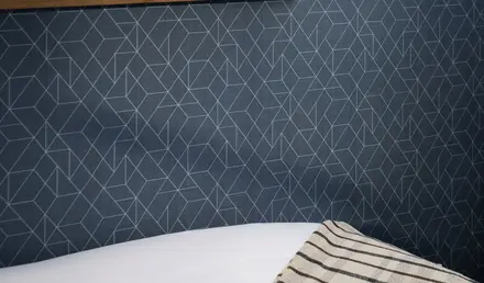 a shelf with a vase of flowers on it